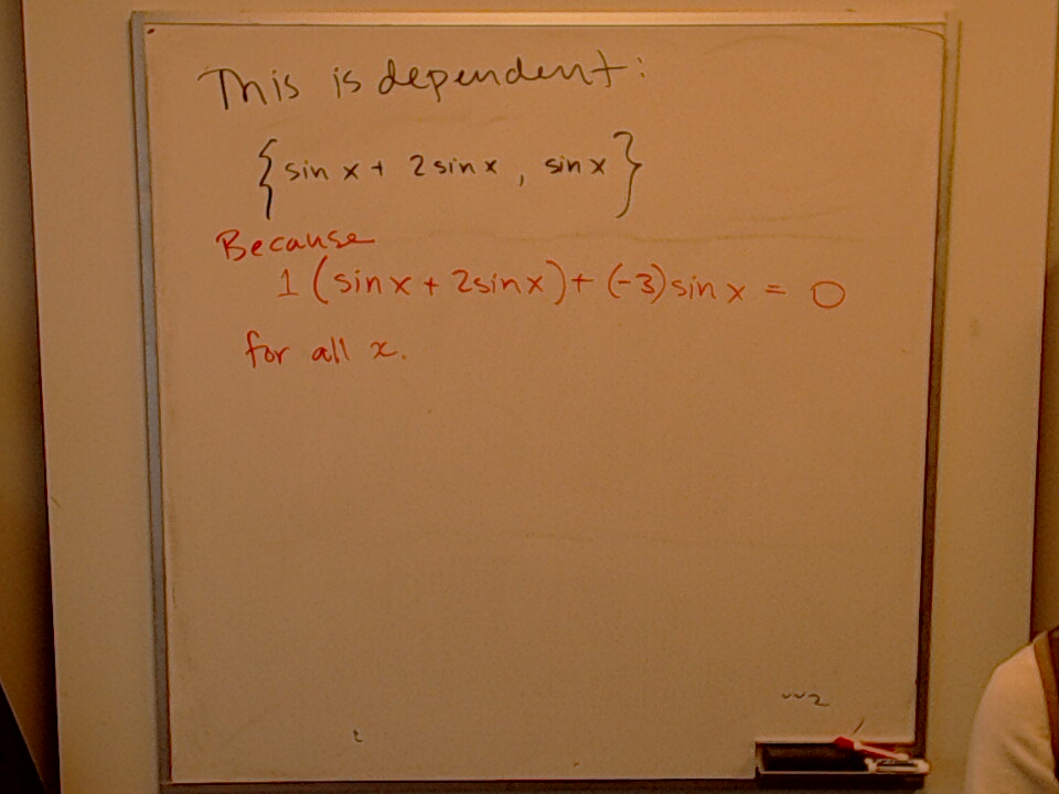 A linearly dependent set A photo of a whiteboard titled: A linearly dependent set