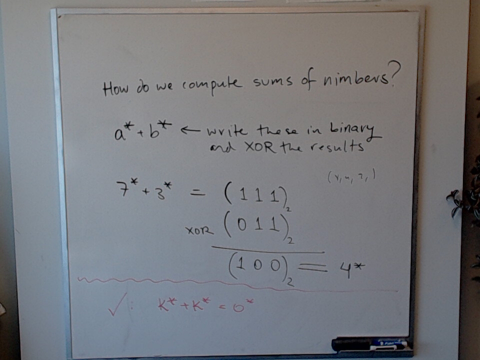 Adding Nimbers A photo of a whiteboard titled: Adding Nimbers