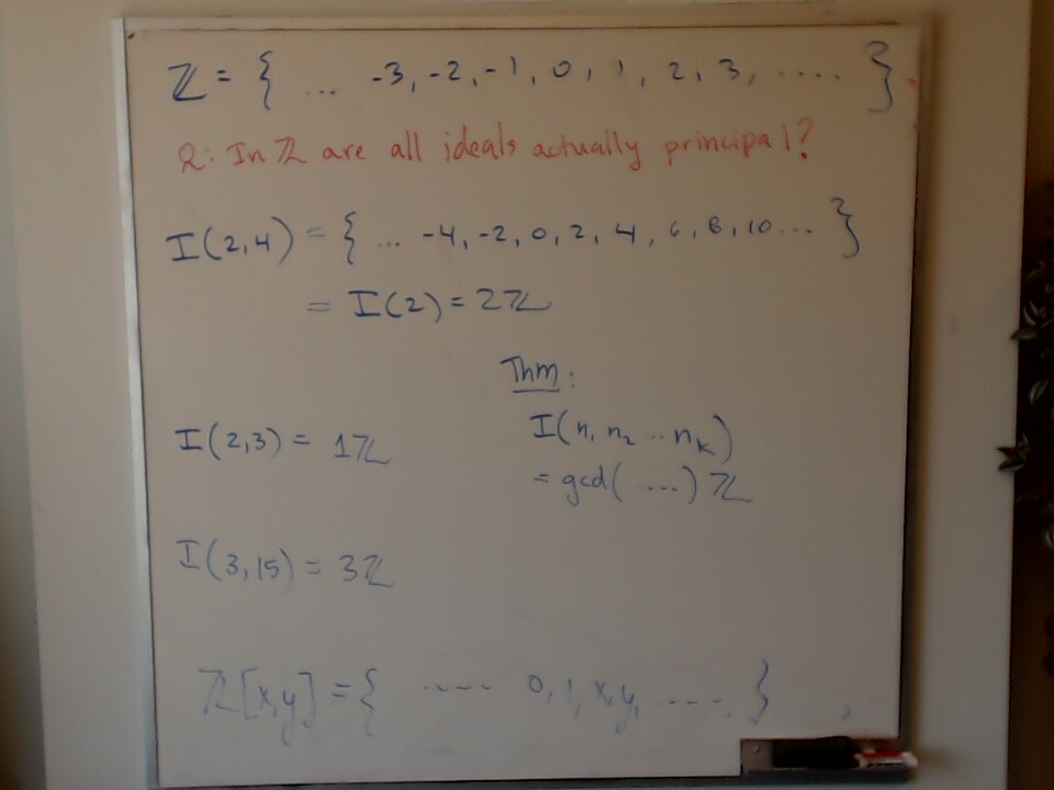 Ideals and Principal Ideals: Are all ideals in Z actually principal? A photo of a whiteboard titled: Ideals and Principal Ideals: Are all ideals in Z actually principal?