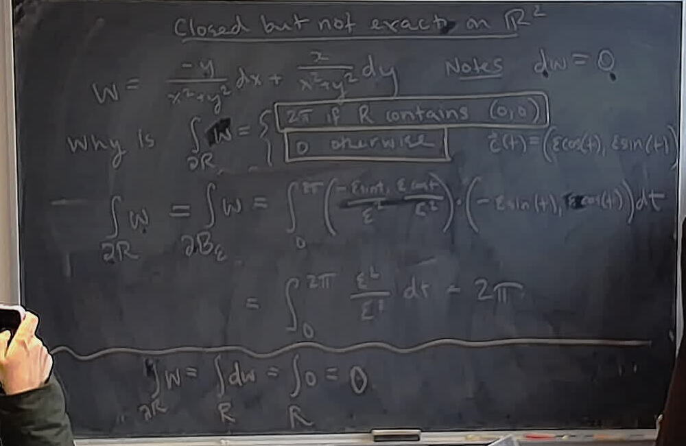 Closed but not exact form on the plane without the origin. (Part 2) A photo of a whiteboard titled: Closed but not exact form on the plane without the origin. (Part 2)