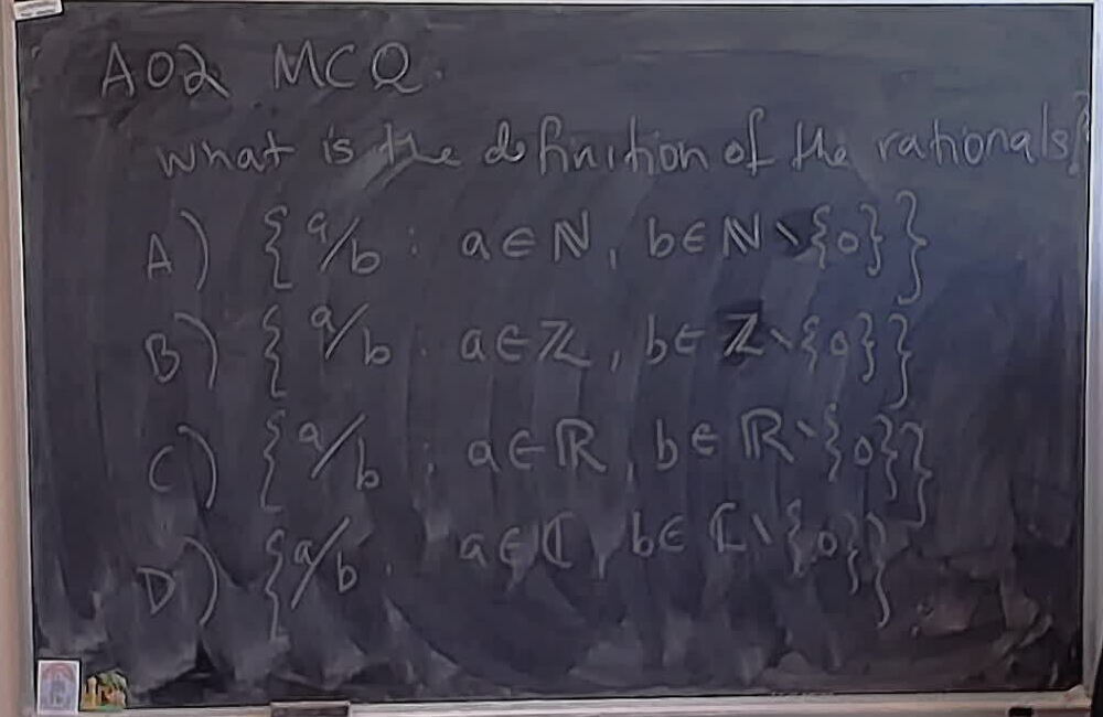 A02 MCQ: Possible definitions of the naturals A photo of a whiteboard titled: A02 MCQ: Possible definitions of the naturals