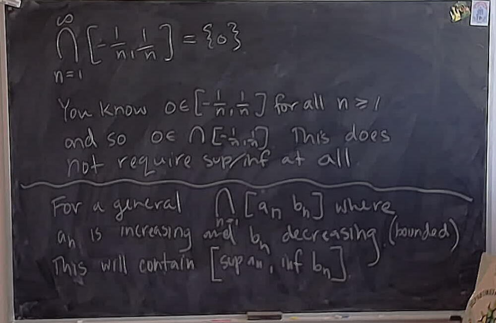 Nested closed intervals and infs and sups. A photo of a whiteboard titled: Nested closed intervals and infs and sups.